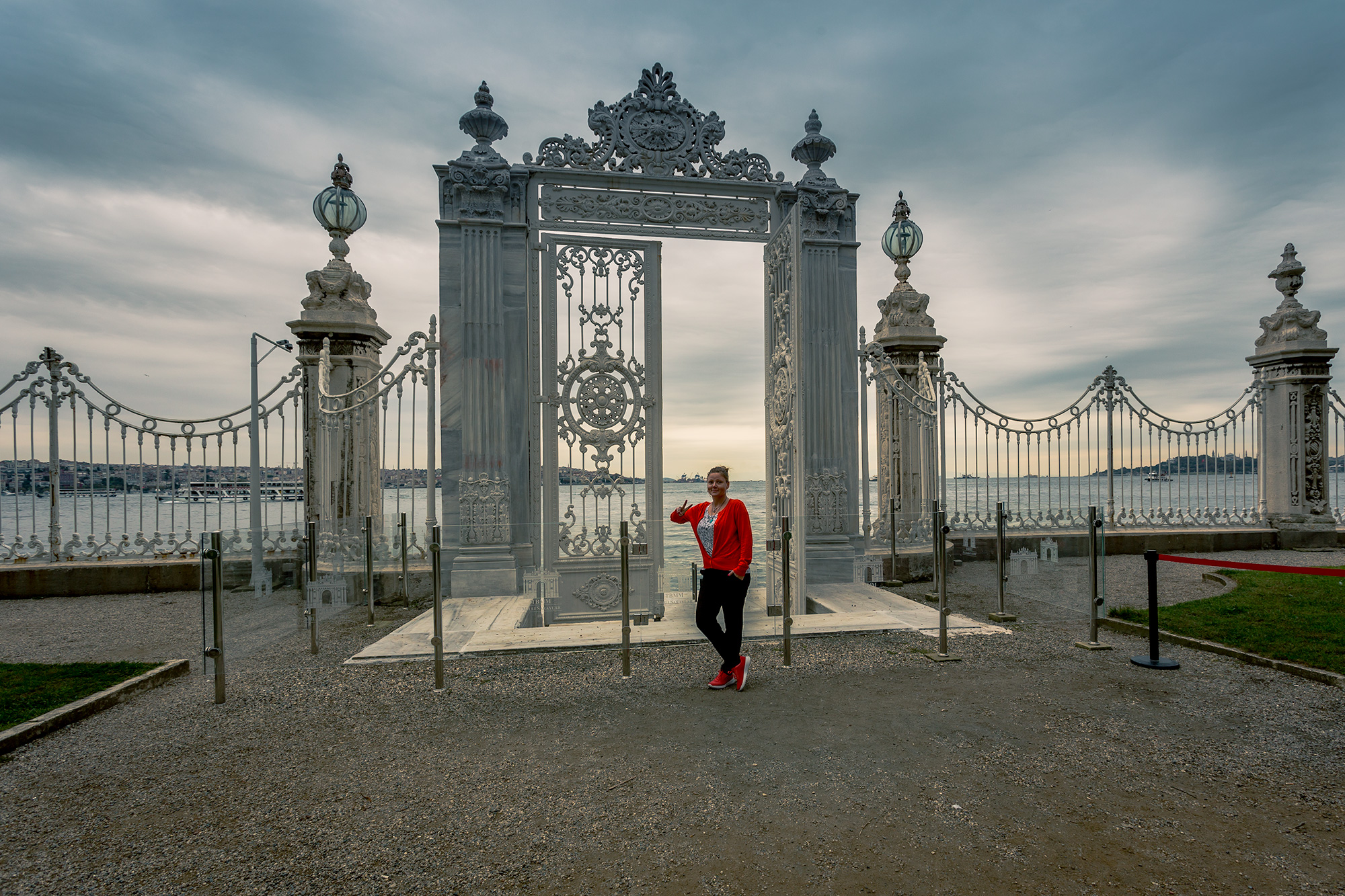 charnette woman posing at dolmabache palace gate