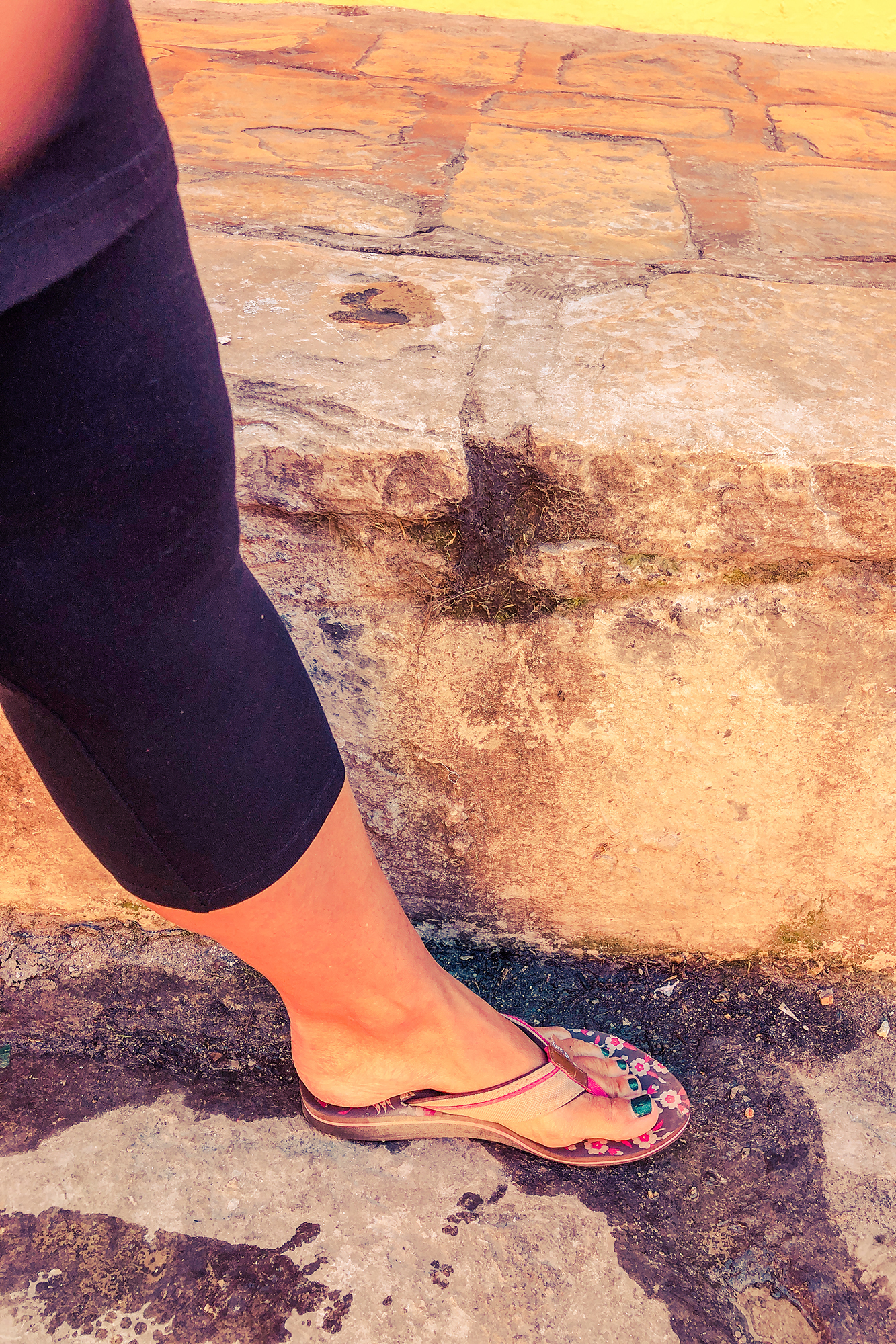 a woman next to the pavement