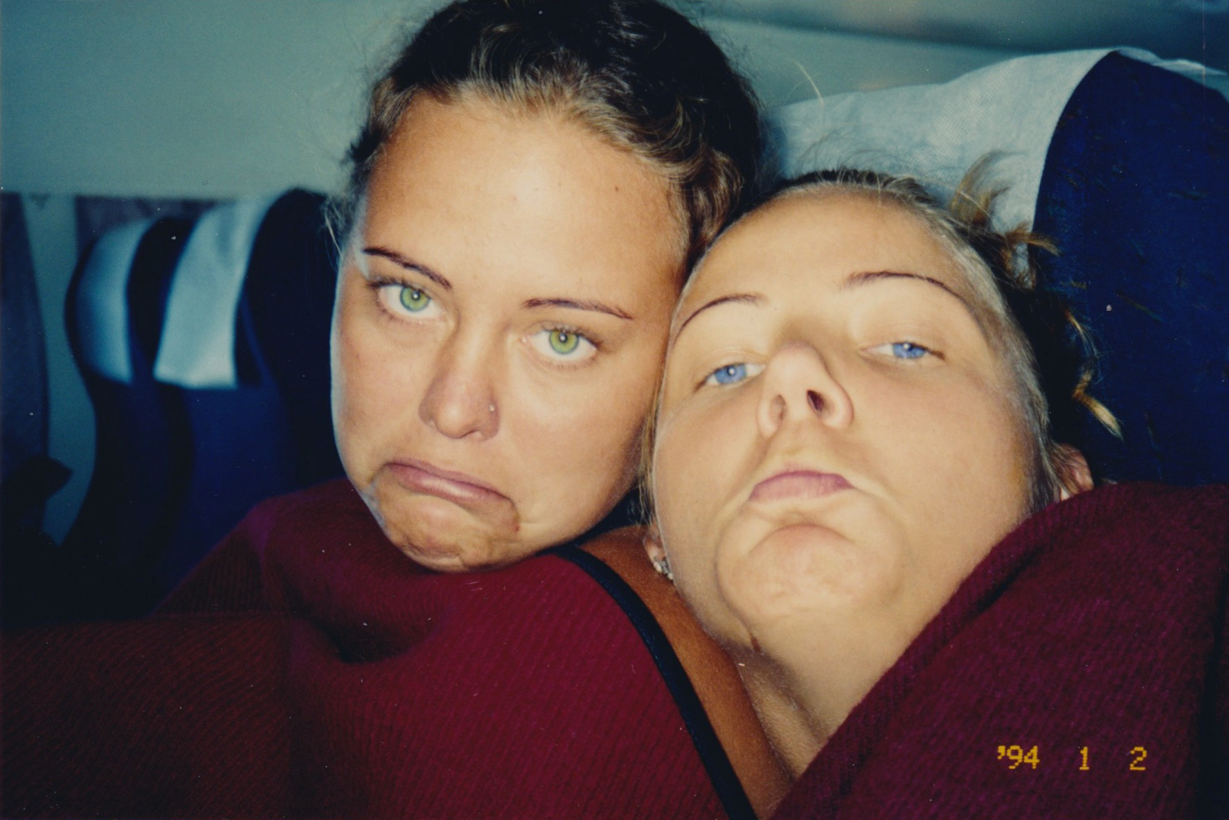 two sad women on a plane