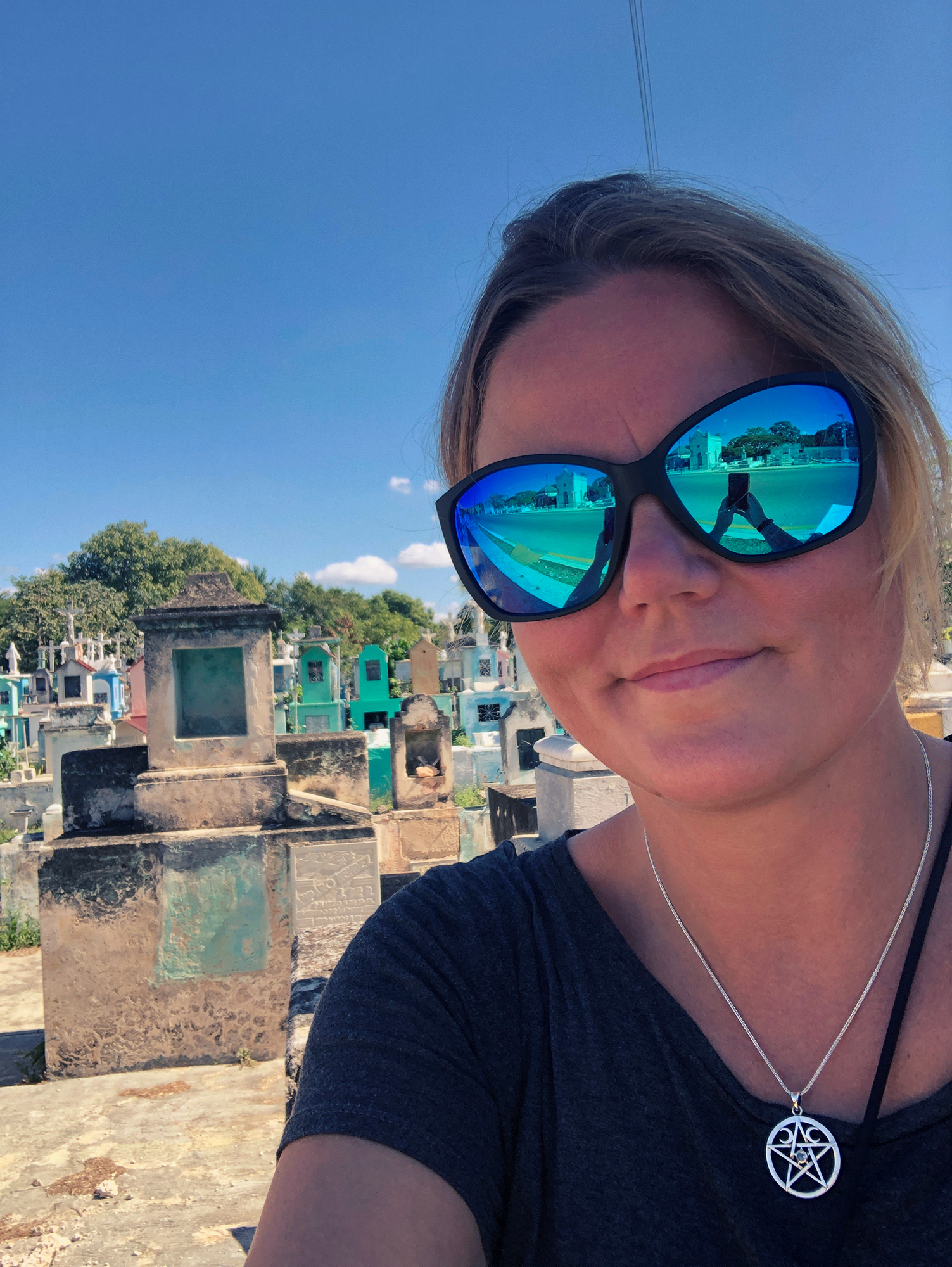 charnette woman taking selfie on merida cemeteries in mexico