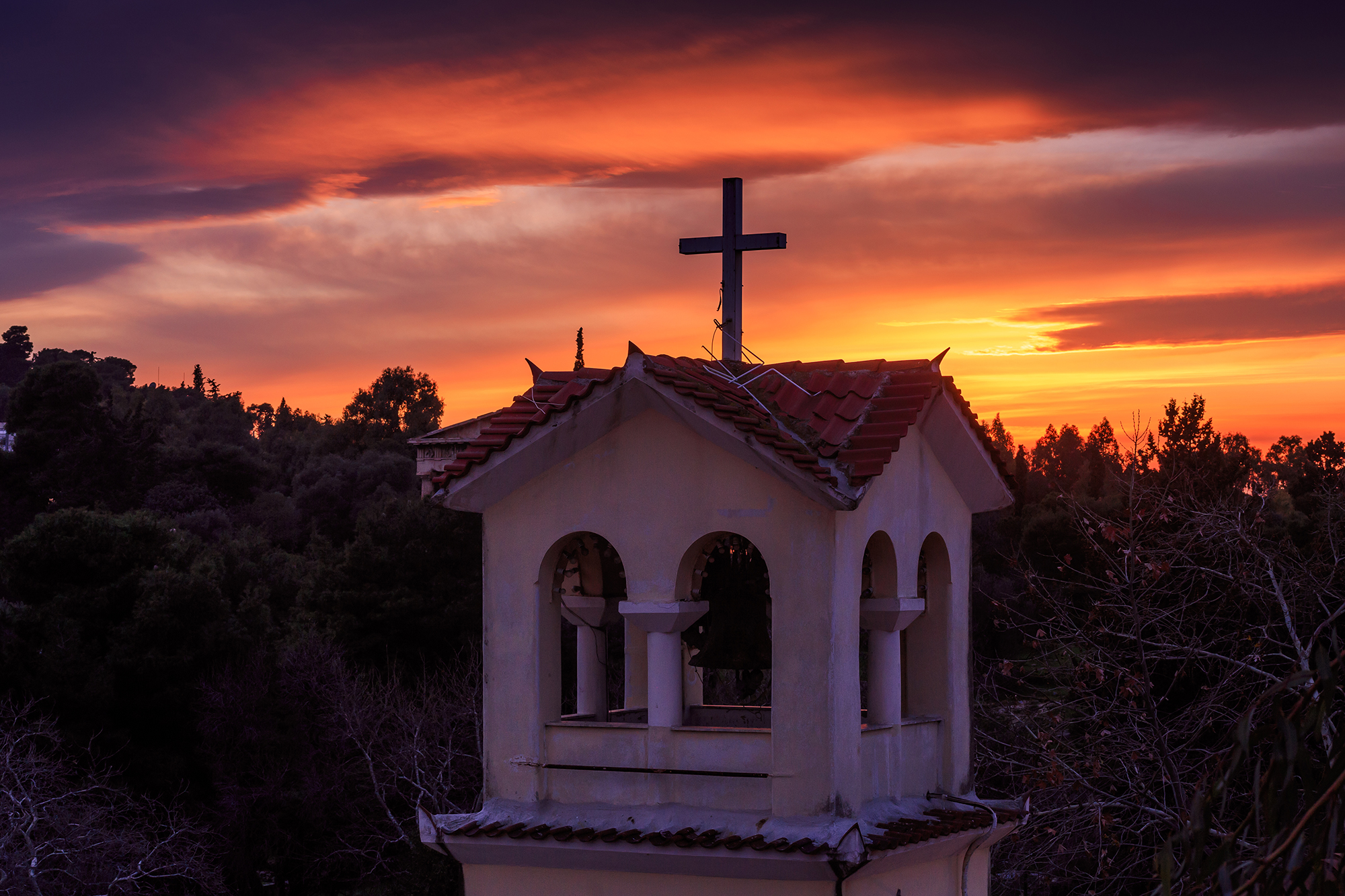 sunset in athens church with cross on top